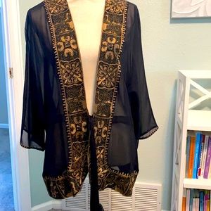 Chico’s black & Gold top. No size tag, it’s comparable to large